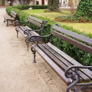 A high angle closeup shot of wooden benches in the park