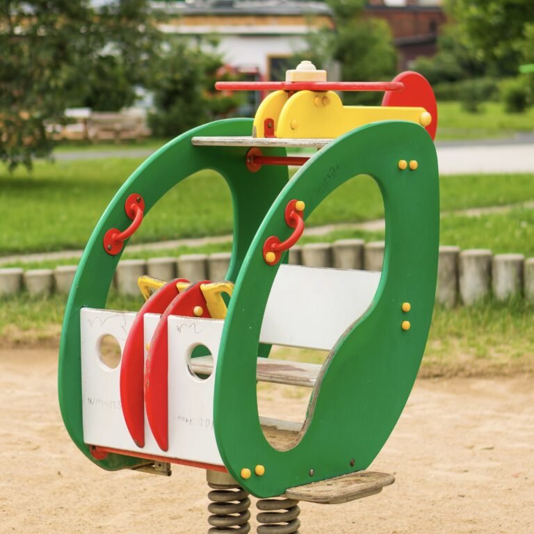 A vertical shot of a kiddie ride in the park